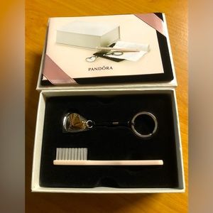 Pandora keychain and cleaning brush